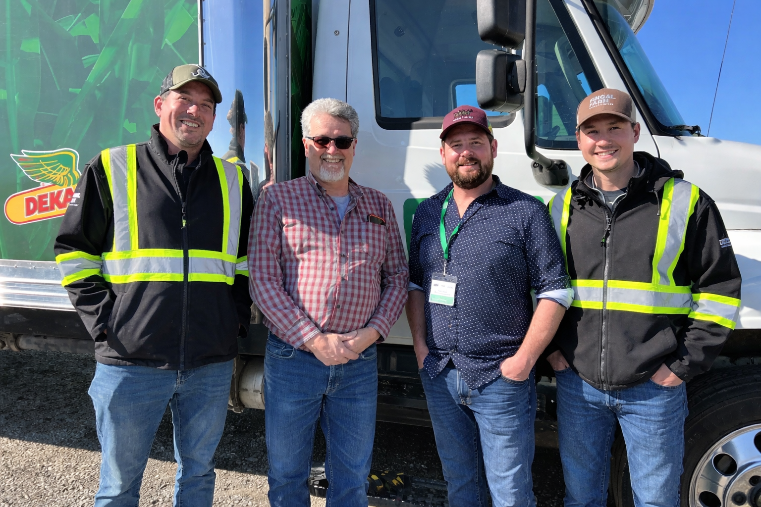 All four partners standing in front of a Fingal truck.